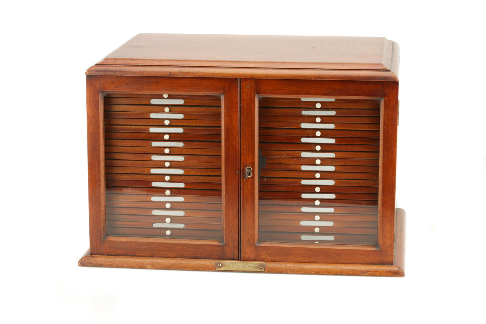 A Large & Good Quality Microscope Slide Cabinet: English, Late Victorian, with a brass plaque to the front which reads 'LIVERPOOL MICROSCOPICAL SOCIETY PROPERTY', cabinet constructed of French polished mahogany with two glazed doors opening to revea