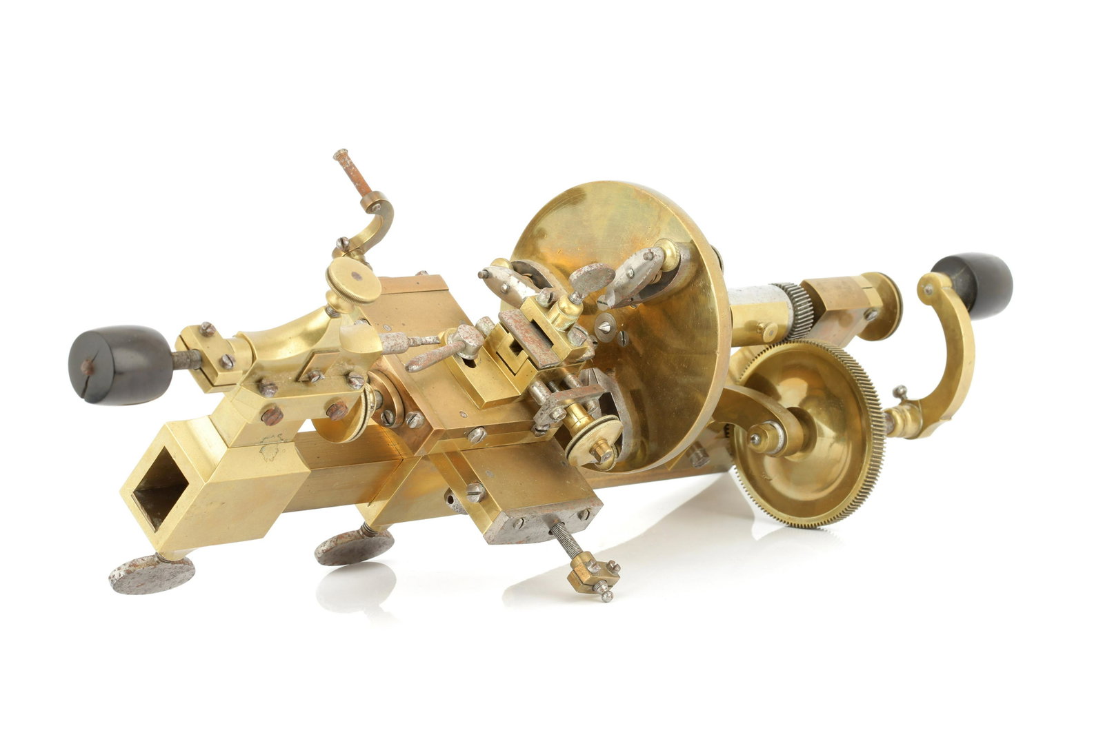 A Geared, Late 19th Century Watchmakers Lathe,: English, Late 19th Century, unsigned, with hand crank driven gear to main steel spindle, 12cm diameter faceplate with 3 fixing points, adjustable tool stock with X-Y control, with adjustable and remov
