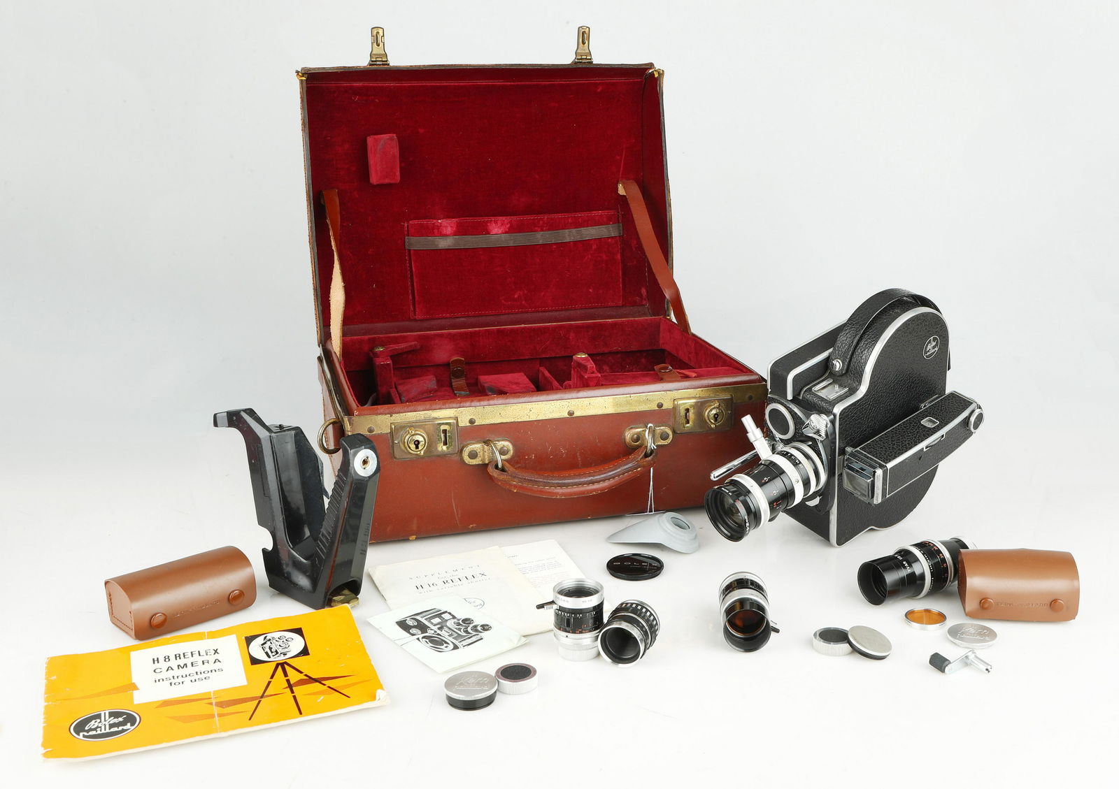 A Bolex H8 Reflex Cine Camera with Five C Mount Lenses,: body ser no. 192653, body VG-E, 12 to 64 fps; Variable shutter, singleframe, frame counter to 2000; Clockwork spring in excellent condition, also with 100â€™ DL Spool, rare 50â€™ DL, paralla