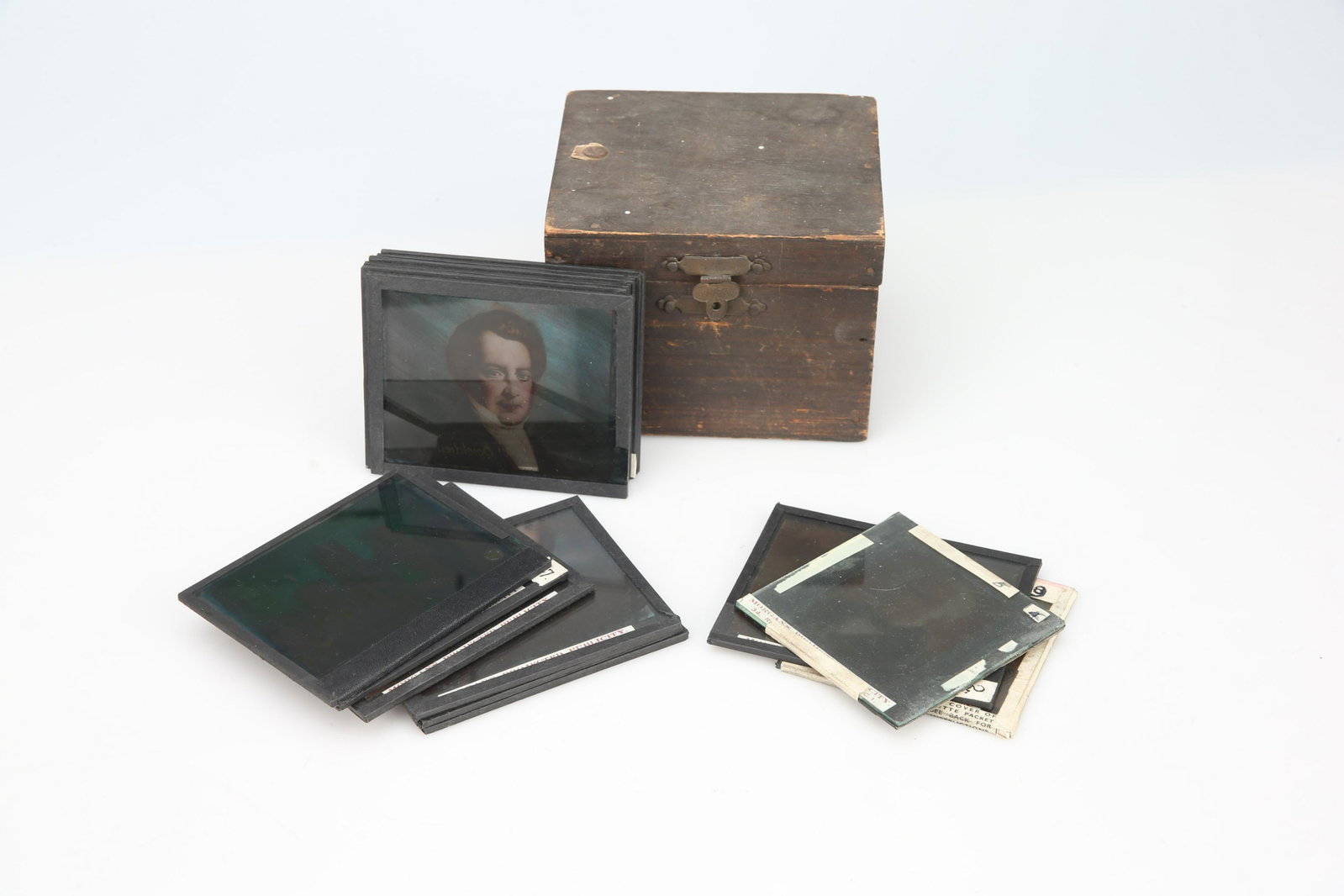 A Collection of Hand Coloured Magic Lantern Slides,: all marked 'Morgans Projected Publicity', in wooden case, approx 14 slides, (Qty: 1)