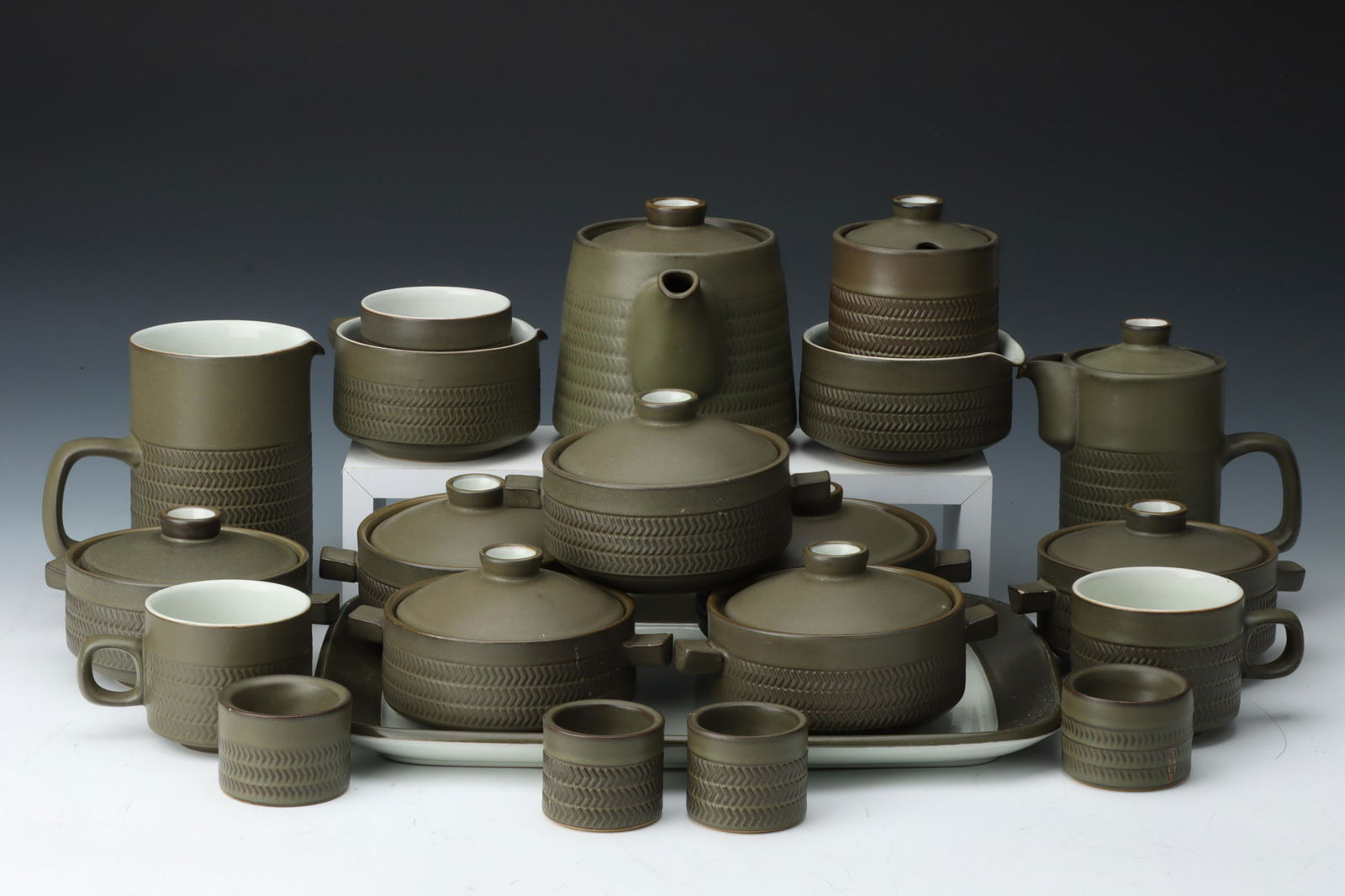 A Denby Chevron Part Dinner Service,: including dinner plates, side plates, soup bowls, sauce boats, serving bowls, tea cups & saucers, egg cups, rectangular tray, and more (50+)