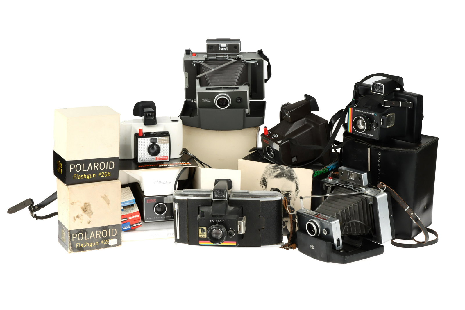 A Selection of Polaroid Cameras,: to include a Land Camera 340, a Swinger Model 20, a Land Camera 100, a Super Colour Swinger III, & others,