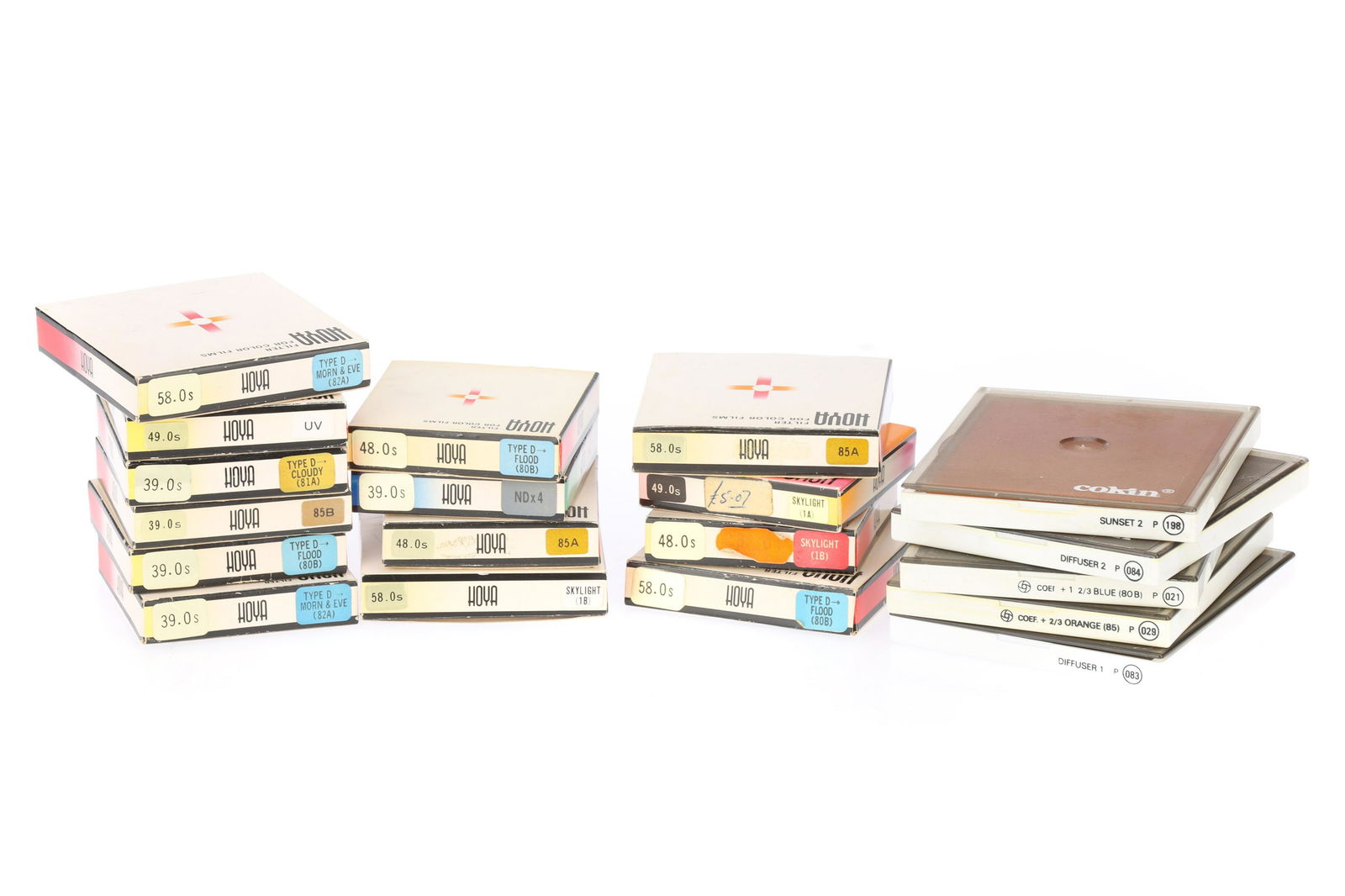 A Collection of Boxed Hoya and Cokin Colour Film Filters: A Collection of Boxed Hoya and Cokin Colour Film Filters comprising a NDx4 39mm, an 80B, an 82A and an 85 all 58mm, an 85 48mm and a Skylight 1A 49mm, two Skylight 1B 49mm filters in a single Hoya box