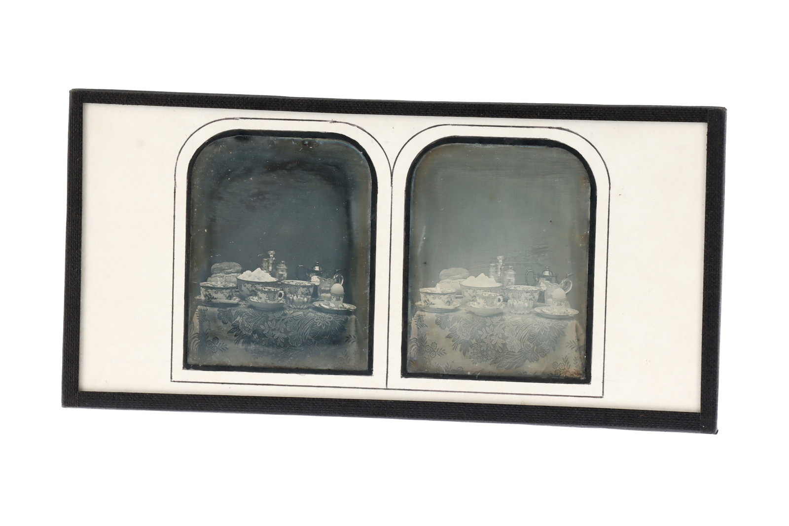 Stereo Daguerreotype of Still Life by Watkins and Hill,: Tea set on a table with bread and boiled egg. Watkins and Hill Opticians label on back. Condition: Very clean image and mat, re-sealed