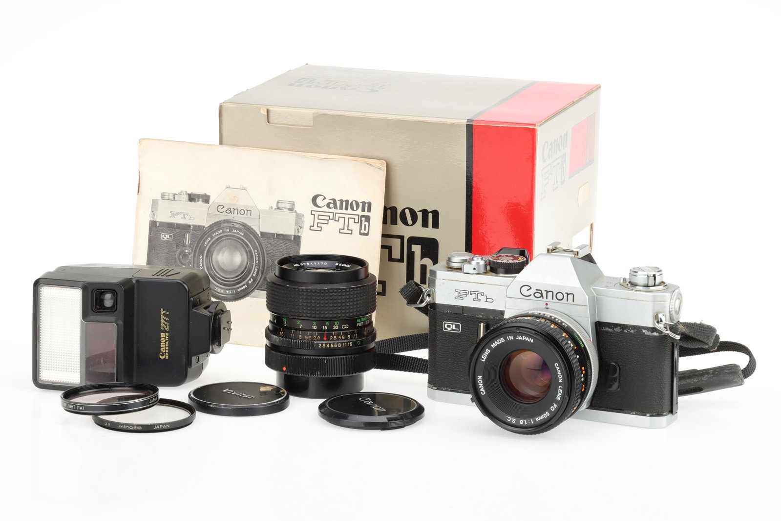 A Canon FTbn QL 35mm SLR Camera: chrome, date code 1977, serial no.602909, with an FD f/1.8 S.C. 50mm lens, serial no.567670, shutter sticking at slowest speeds and not opening at 1/1000s, body F, lens F, fungus, also a Vivitar Auto 