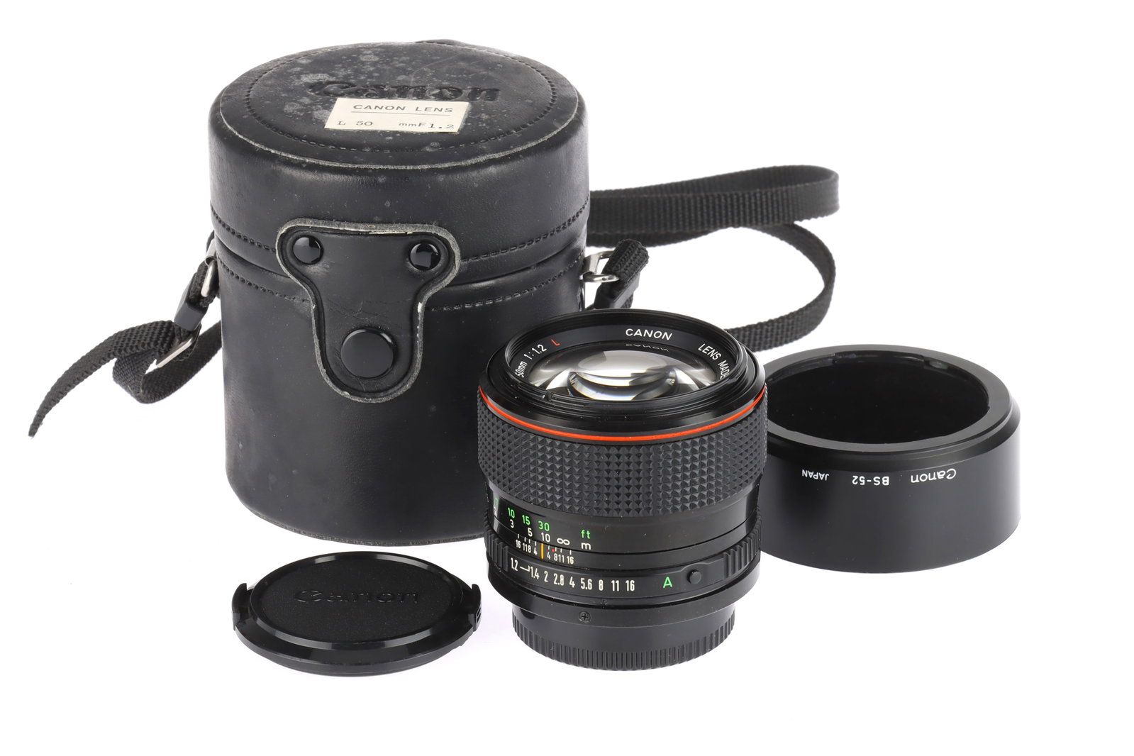 A Canon FDn f/1.2 L 50mm Lens: date code 1980, serial no.10654, body G-VG, optics G-VG, with BS-52 lens hood, LH-B9 lens case and caps
