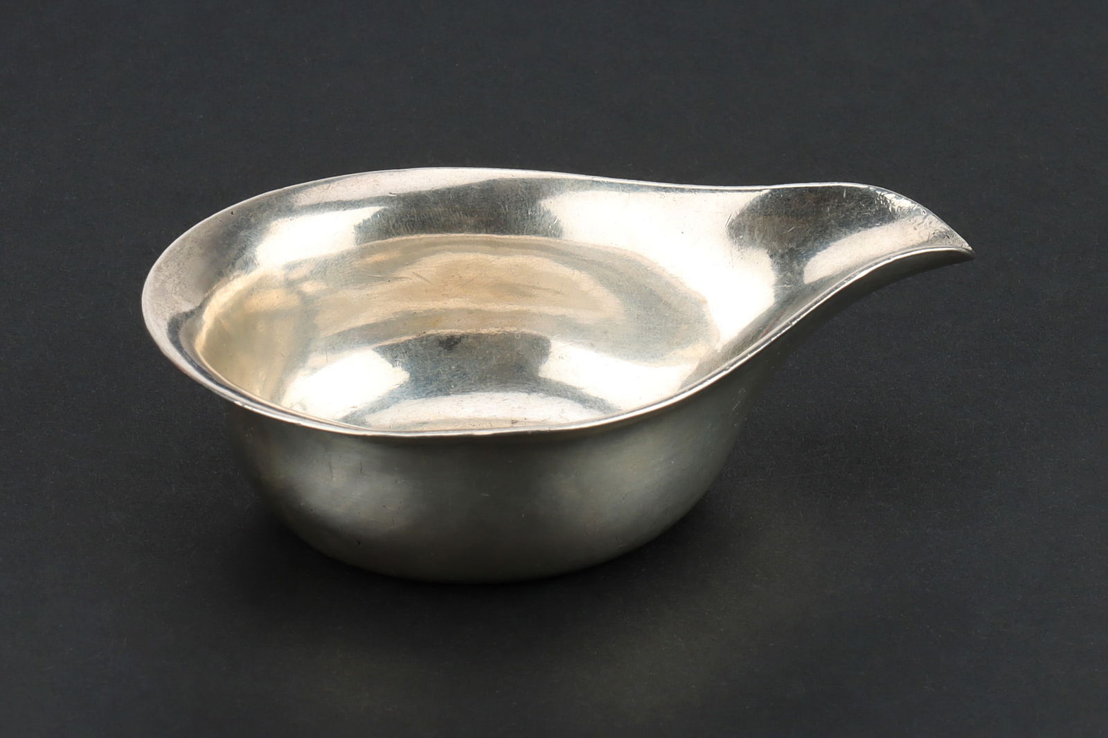 A Colonial Indian Silver Pap Boat,: by David Hare, Calcutta, c.1800-1815, 10.4cm. (length), 65g Note: Previously bought at Philips on 30th November, 2001 (Lot 49).