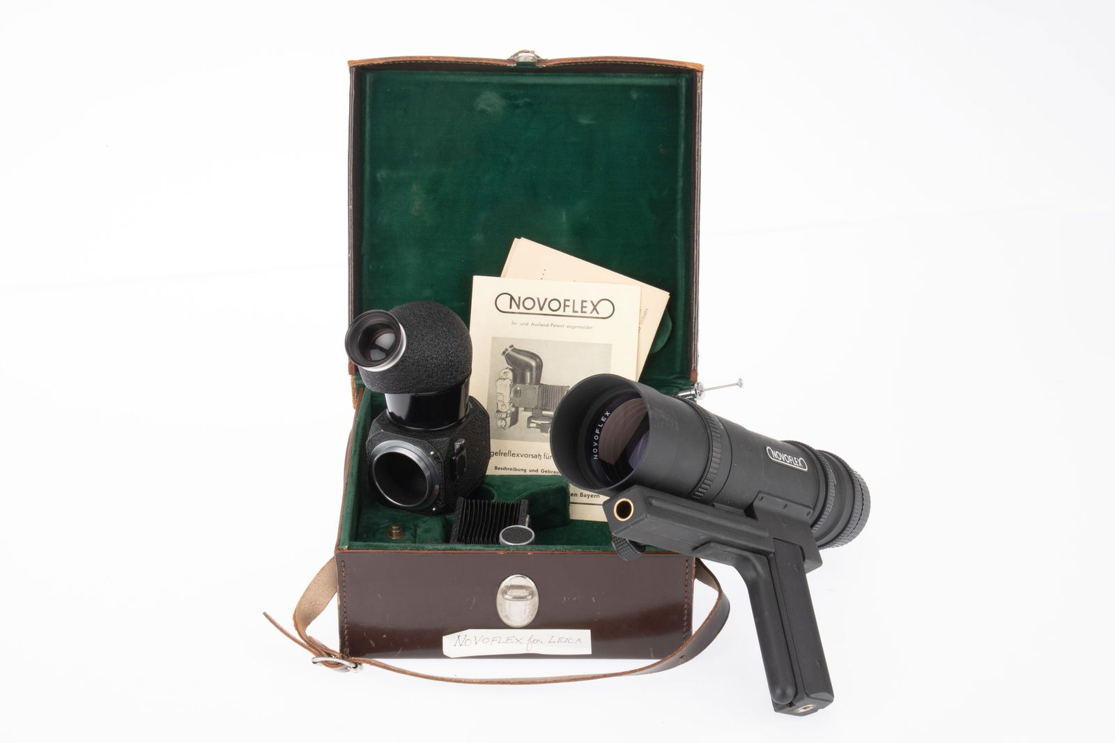 A Small Selection of Leitz Novoflex Accessories,: comprising a Noflexar f/3.8 200mm pistol grip lens, barrel G, optics F-G with cleaning marks to front element, and a mirror viewfinder and bellows kit, in fitted leather case.