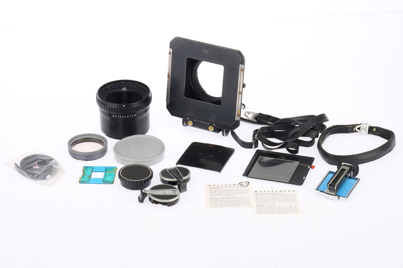 A Hasselblad 250 Bellows and 55 Extension Tube,: to include a Hasselblad 250 Bellows, condition F, rack is stiff, a 55 Extension Tube, condition G, shutter trigger working, hand strap with Hasselblad branded lugs, and small accessories.