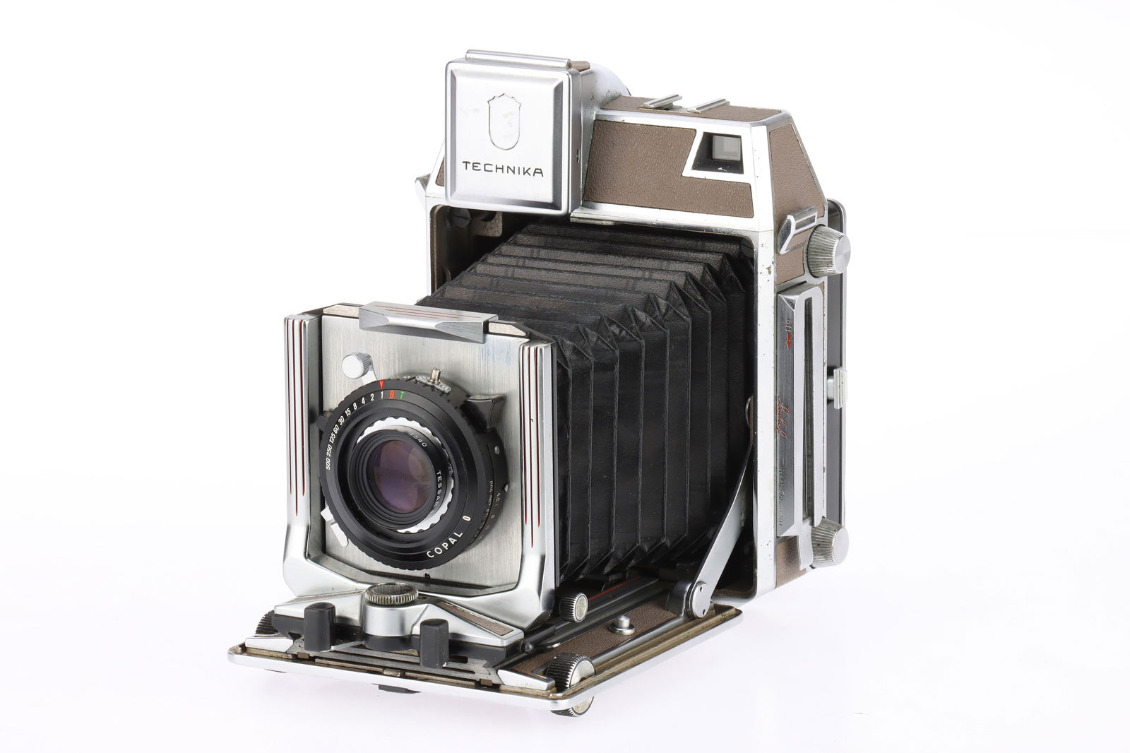 A Linhof Super Technika IV 6x9cm Medium Format Camera: brown, 1956-64, serial no.86178, with a Docter-Wetzlar Tessar f/4.5 105mm lens, Copal O shutter working, body G-VG, Linhof logo from viewfinder cover missing, bellows G, lens G-VG, dust
