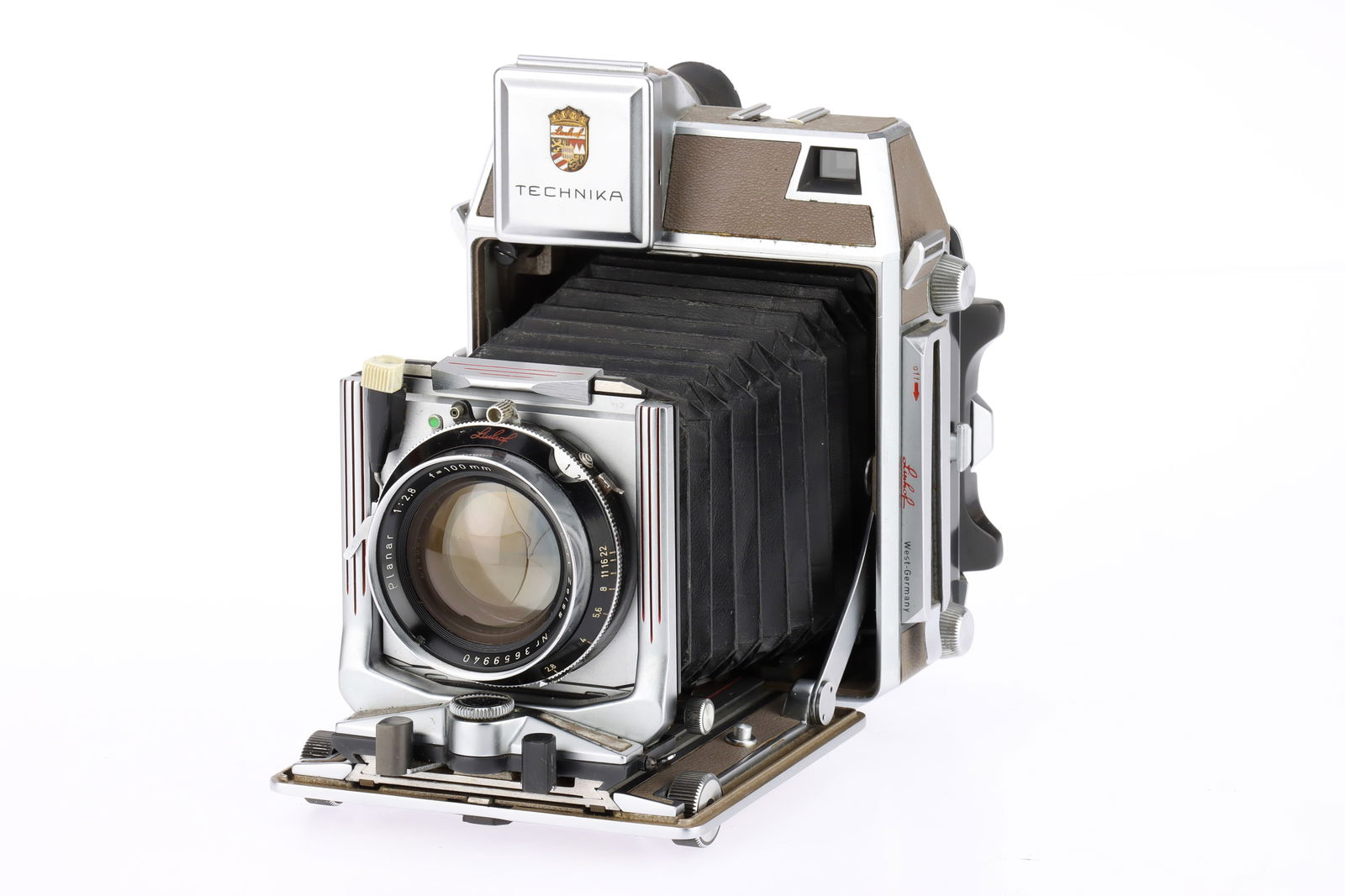 A Linhof Super Technika IV 6x9cm Medium Format Camera: brown, 1956-62, serial no.89585, with a Carl Zeiss Planar f/2.8 100mm lens, 1961-64, serial no.3659940, shutter working but sluggish at lowest speeds, body VG, bellows G, lens VG, very light haze