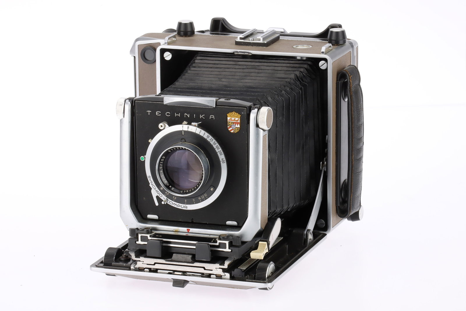 A Linhof Super Technika Model V 5x4in. Large Format Camera: beige, 1963-76, serial no.2141366, with a Schneider-Kreuznach Xenar f/4.5 150mm lens, serial no.5182431, Synchro-Compur shutter working, 270mm rangefinder cam fitted, body G, bellows appear light tigh