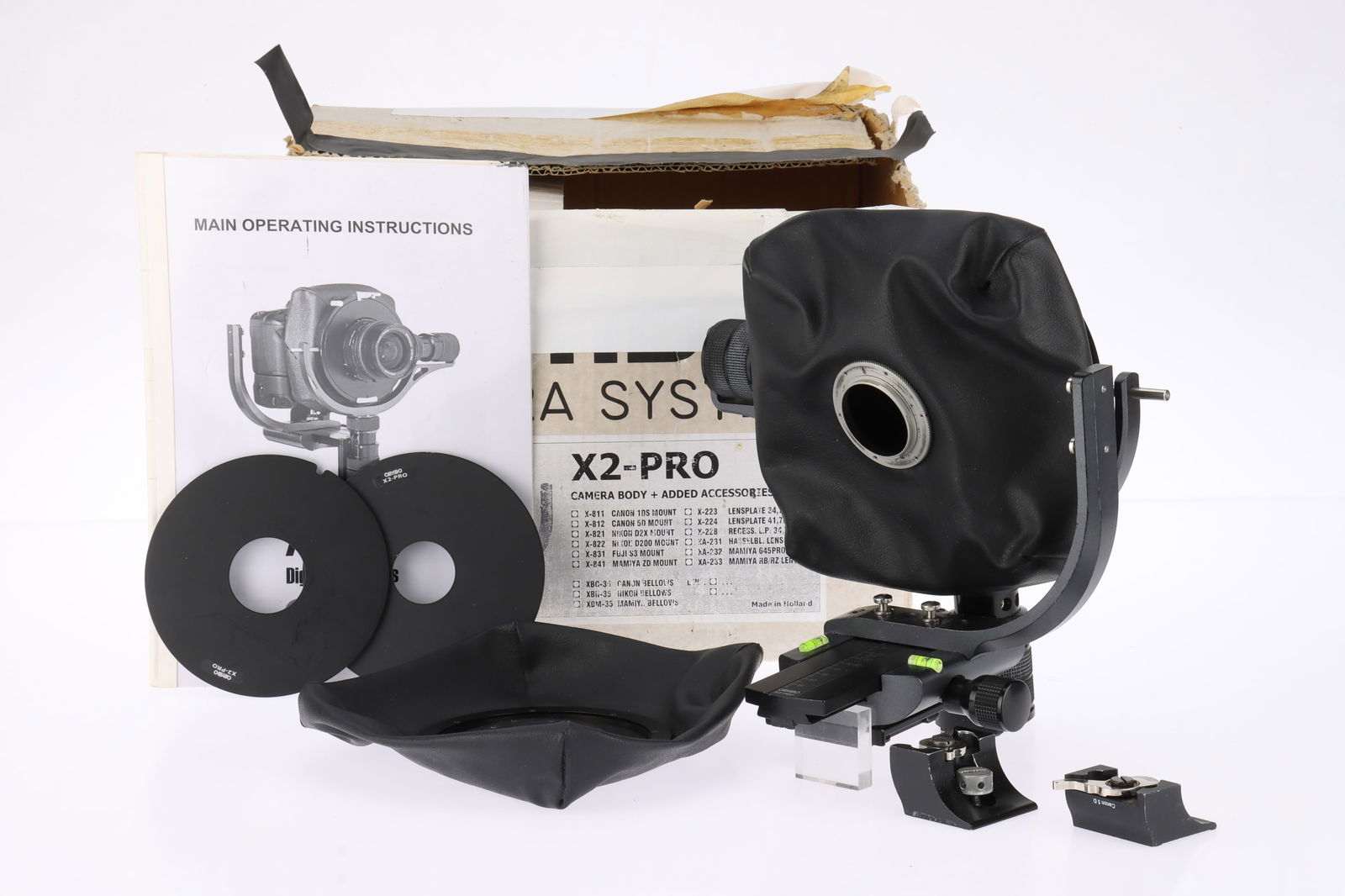 A Cambo X2-Pro Camera,: for Nikon to Hasselblad V mount, complete with additional set of bellows, two additinoal lens boards, instructions and maker's box