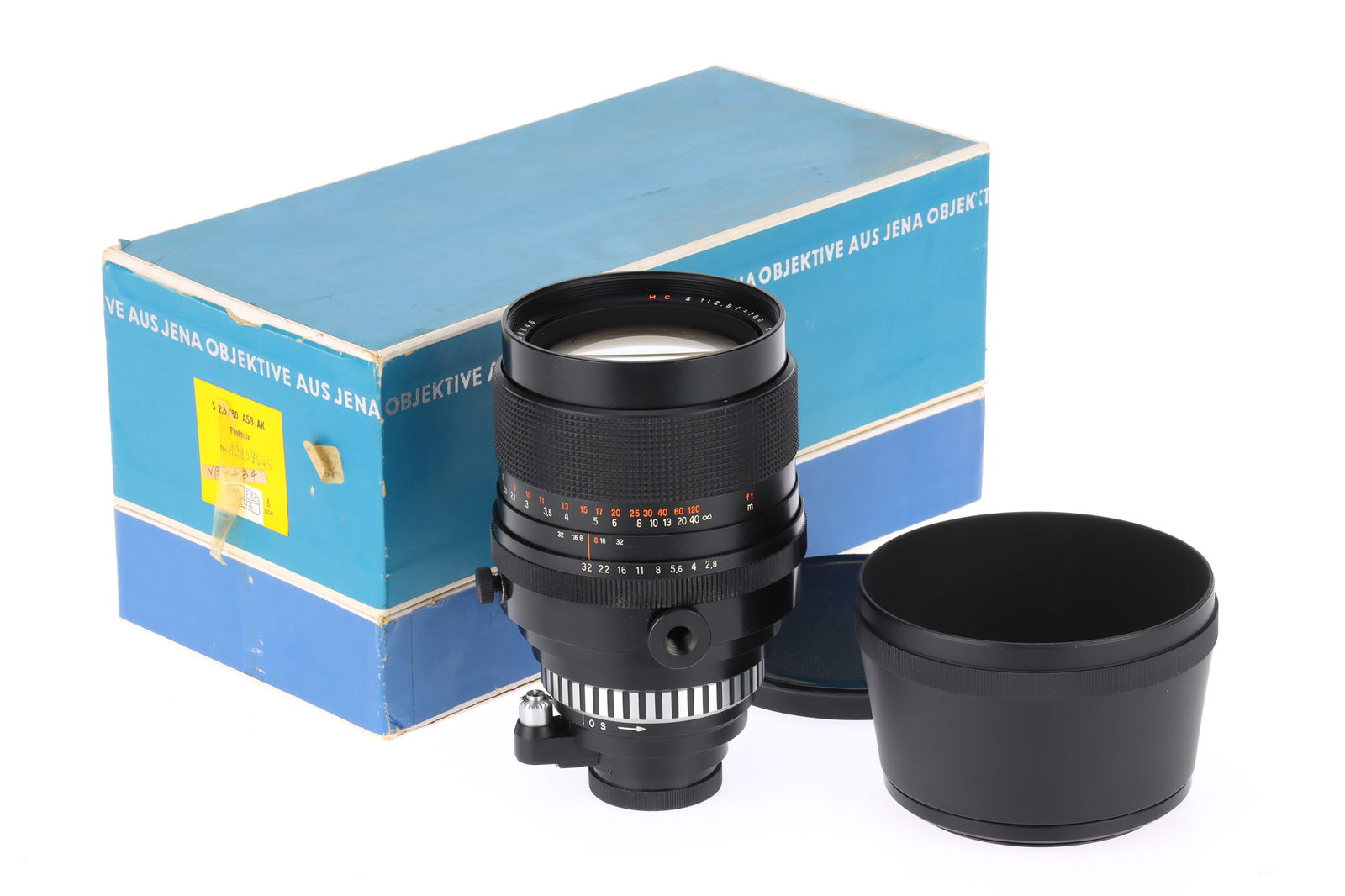 A Carl Zeiss MC Sonnar f/2.8 180mm Camera Lens,: A Carl Zeiss MC Sonnar f/2.8 180mm Camera Lens, black, body G-VG, Exakta mount, barrel VG, optics G with light dust, with hood, cap and maker's packaging.