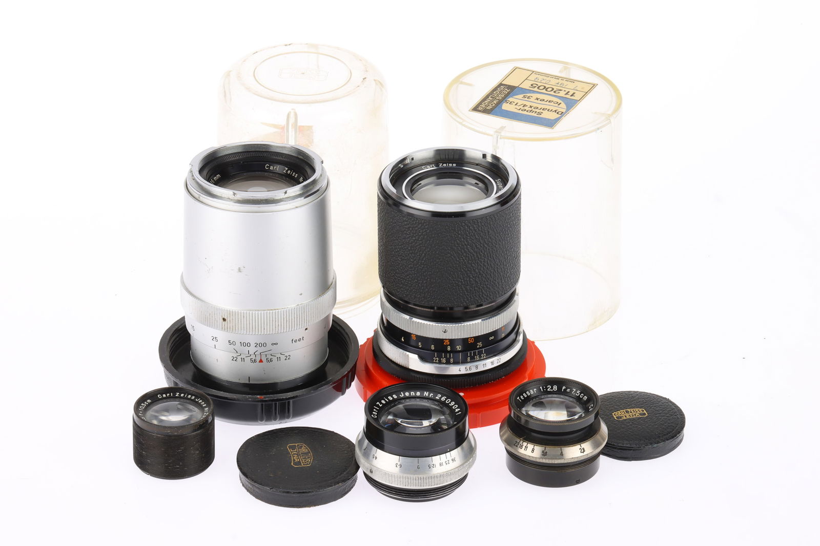 A Group of Carl Zeiss Jena Lenses: A Group of Carl Zeiss Jena Lenses includes a Sonnar f/4 135mm, in bubble, body fair, optics good, a Super-Dynarex f/4 135mm in bubble, body G, optics F, and three smaller lenses, optics F.
