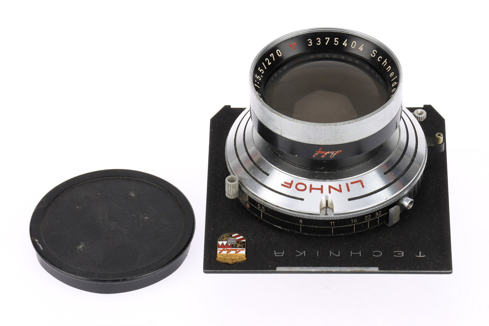 A Schneider-Kreuznach Tele-Xenar f/5.5 270mm Camera Lens: A Schneider-Kreuznach Tele-Xenar f/5.5 270mm Camera Lens serial 3375404, barrel F-G, optics F-G with light dust and haze, attached to a Linhof Compur shutter, working at all speeds, mounted on a Techn