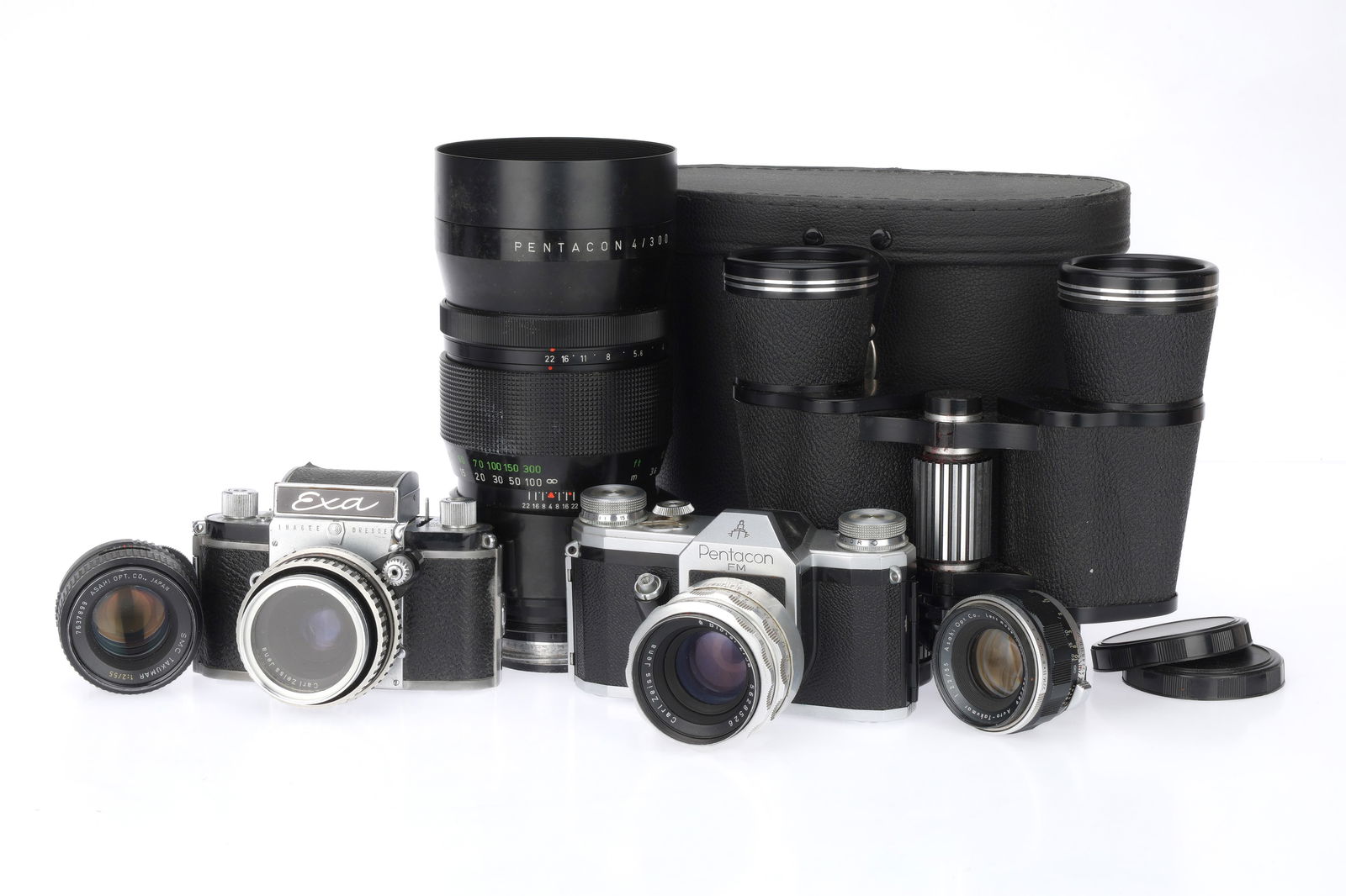 A Pair of 35mm SLR Cameras,: A Pair of 35mm SLR Cameras, to include a Pentacon FM, black, body G, shutter curtains need attention, advances, attempts to fire, with Carl Zeiss Jena Biotar f/2 58mm lens, chrome, barrel F-G, apertur