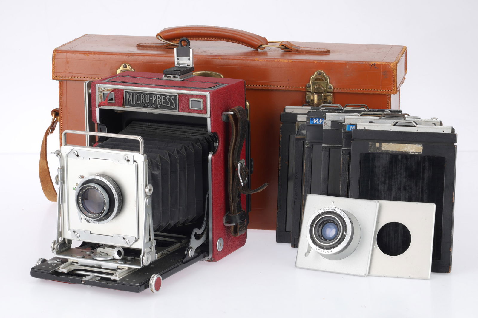An M.P.P. Micro-Press 5x4 Camera,: An M.P.P. Micro-Press 5x4 Camera, red, body G, small amount of peeling of leatherette to front, bellows extends and locks, not light tested, rangefinder patch is clear and moves with the front standar