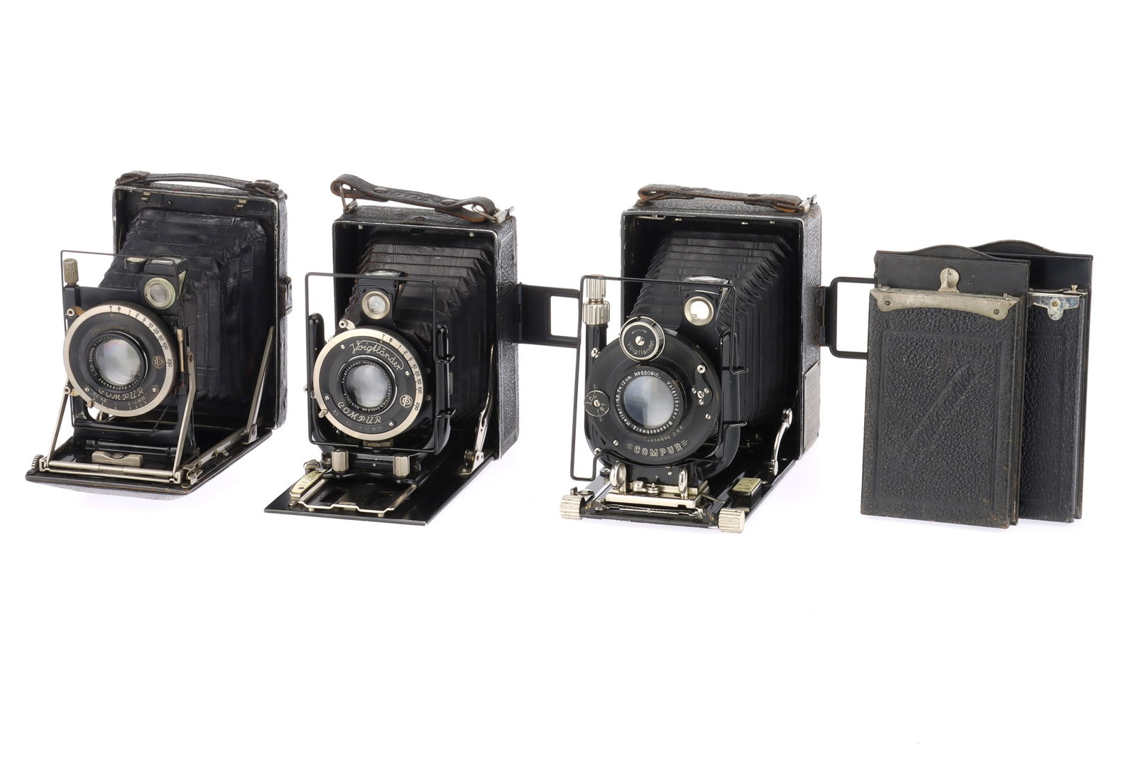 A Pair of Voigtlander Folding Plate Cameras.: A Pair of Voigtlander Folding Plate Cameras. to include a Voigtlander Bergheil 6.5x9, black, body F, bellows extends but does not lock in place, shutter working, with a Hellar f/4.5 12.5cm lens, optic