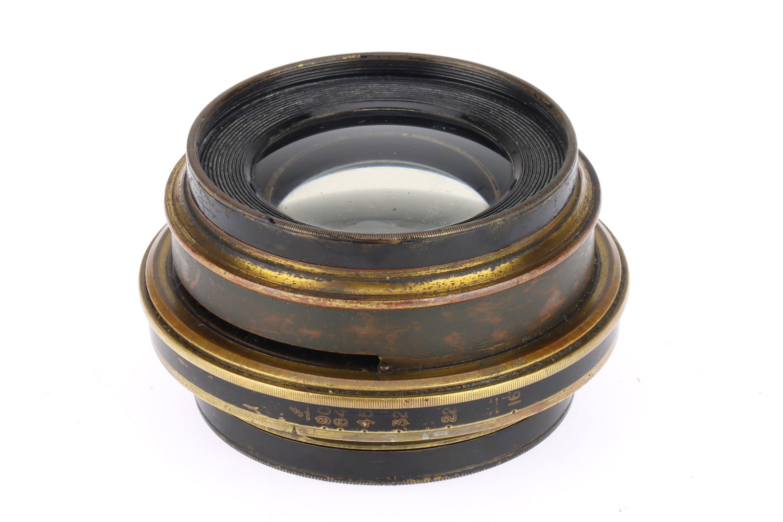 An Unbranded Brass Lens,: An Unbranded Brass Lens, brass, barrel F-G, optics F with haze and cleaning marks, unknown focal length, aperture f/16.