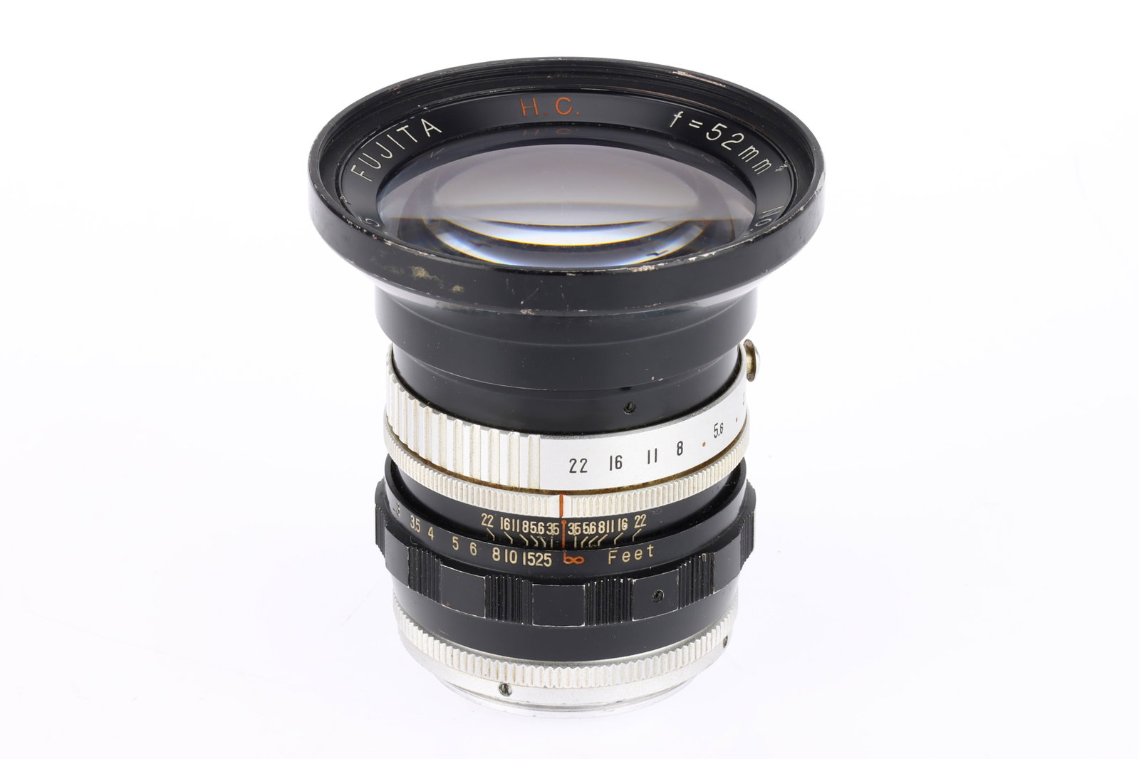 A Fujita H.C. f/3.5 52mm Lens,: A Fujita H.C. f/3.5 52mm Lens, black/chrome, serial number 7747, barrel G, optics F with some fungus, screw mount.