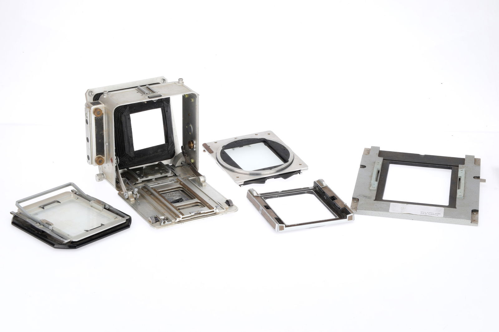 A Selection of M.P.P. 4x5 Camera Components,: A Selection of M.P.P. 4x5 Camera Components, to include a bellows, ground glass and plate holder, and a plate custom-made for the MPP Users Club, for the camera back