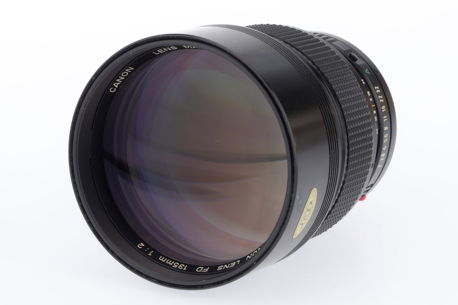 A Canon FD f/2 135mm Lens,: A Canon FD f/2 135mm Lens, black, serial no. 25978, body, VG-E, elements, VG, some very light internal haze
