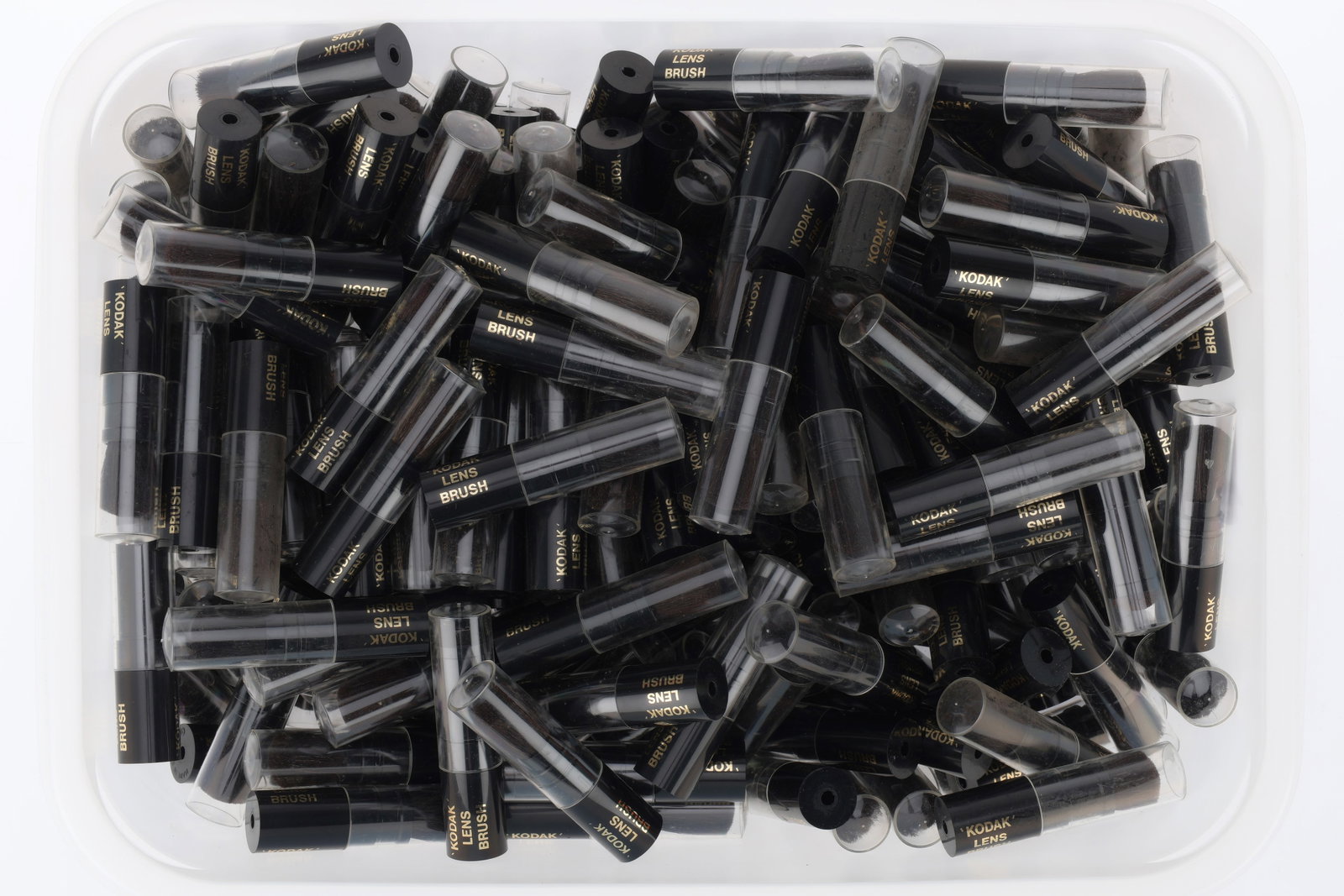 A Very Large Number of Kodak Lens Brushes,: A Very Large Number of Kodak Lens Brushes, black, with lids,