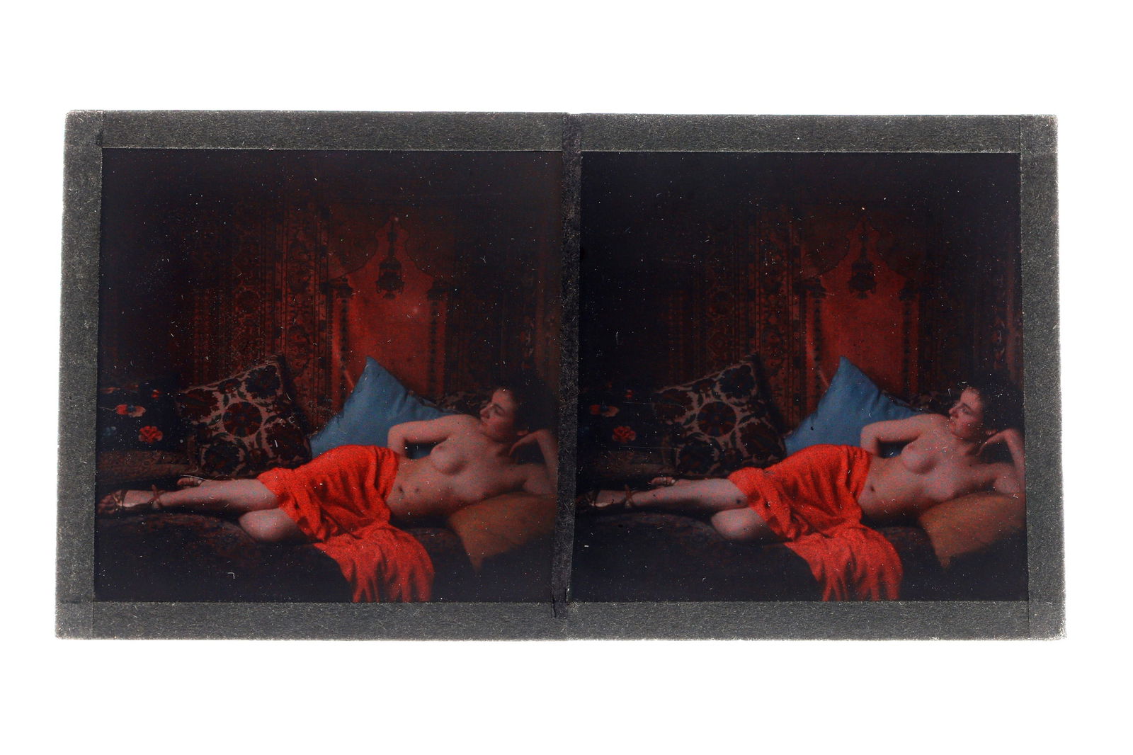 An Erotic Nude Autochrome Stereoview, 1920's: c.1920, colour glass plate images of reclining nude with dark hair, 12.9cm x 6.8cm overall