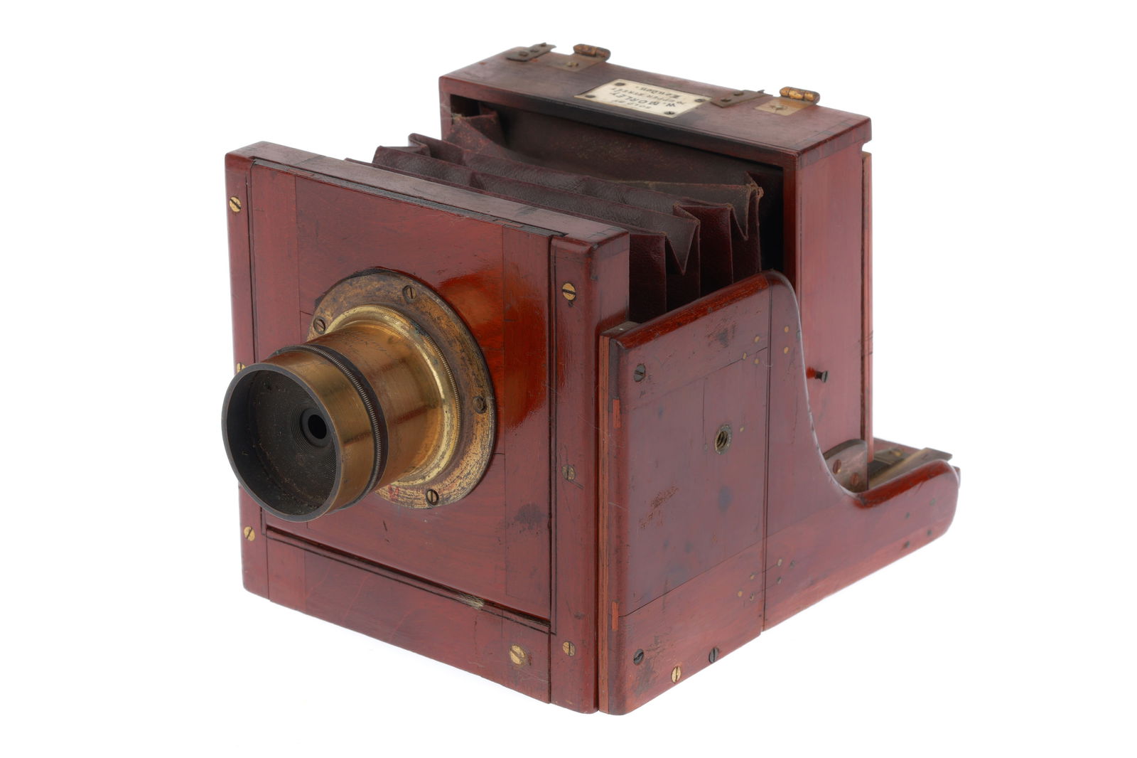 A Morley & Son Quarter plate Tailboard Camera,: A Morley & Son Quarter plate Tailboard Camera, hahogany and brass construction, body F-G, bellows F-G, rack and pinion extension, focusing screen intact, with a J. H. Dallmeyer brass lens, optics VGFo