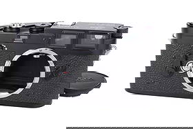 A Leica M3 'Factory Black Re-Paint' Rangefinder Body,: 1955, black paint, serial no. 802436, body, VG-E, shutter working Note: According to the vendor, this camera was repainted to black enamel by Leica Canada in the 1960's. The quality and finish are as