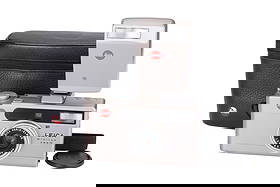 A Leica Minilux Zoom Compact 35mm Camera,: 1998-2003, champagne, serial no. 2451315, with Leitz Vario-Elmar f/3.5-6.5 35-70mm lens, body, VG-E, powers up and appears to function, elements, E, complete with flash unit and maker's case Note: A 5