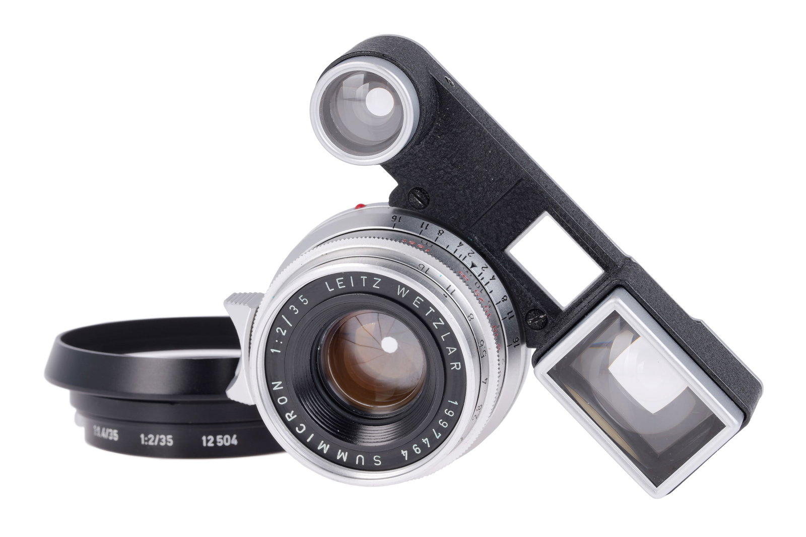 A Leitz Summicon f/2 35mm Lens,: with ocular attachment, chrome, serial no. 1997494, body, VG, elements, G-VG, some light internal haze and a few cleaning marks to the front element, complete with maker's lens hood Note: A 5% import
