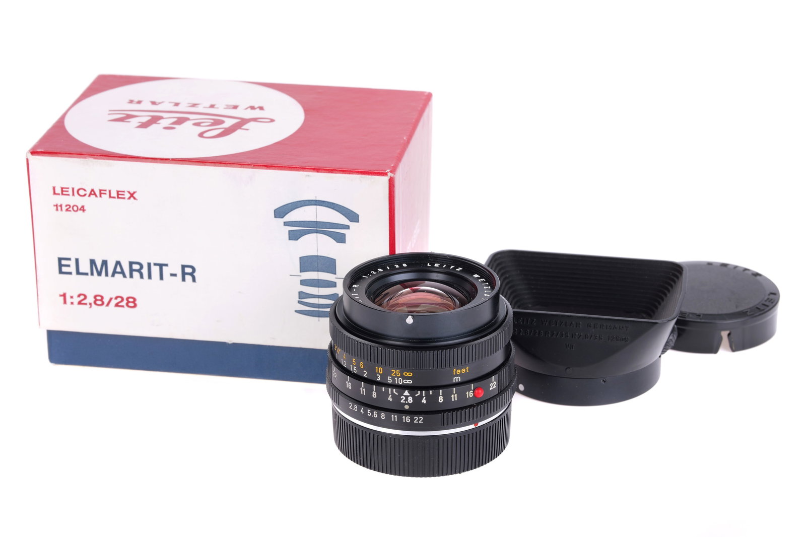 A Leitz Elmarit-R f/2.8 28mm Lens,: 2-cam, black, serial no. 2669920, body, G, elements, VG, some light internal haze, complete with lens hood, caps and maker's box Note: A 5% import VAT applies to this lot for UK bidders only. Internat