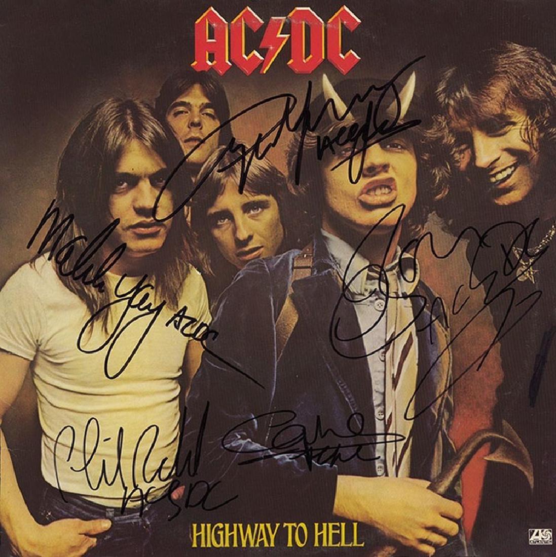 AC/DC Autographed Highway To Hell Album: Autographed by Bon Scott, Malcolm Young, Angus Young, Phil Rudd, and Cliff Williams. 12 x 12 in. Great condition.