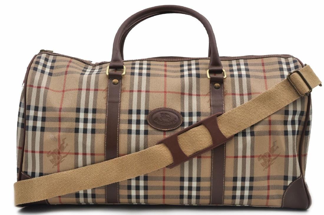 Burberrys Boston Travel Boston Bag: MaterialPVC ColorBrown/Beige StyleBoston Bag Handle Drop 4.3"(Approx) W20.1inches (51cm) H10.6inches (27cm) D9.1inches (23cm) Strap Drop- Handle Drop4.3inches (11cm) Slight interior discoloration w/ m