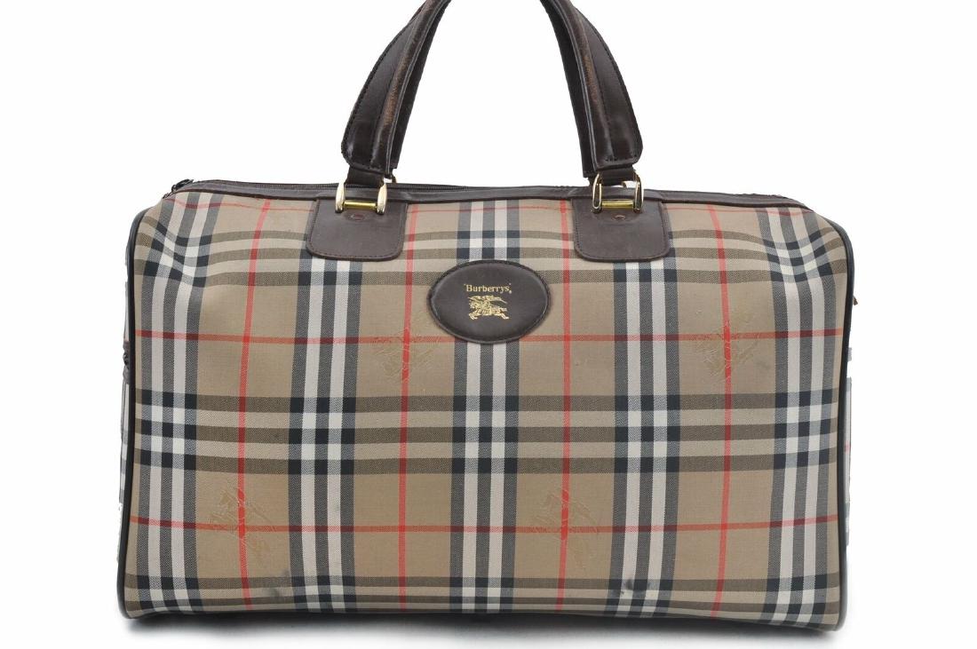 Burberry Brown Beige Nova Check Travel Bag: MaterialCanvas ColorBrown/Beige StyleBoston Bag Handle Drop 5.1"(Approx) W17.7inches (45cm) H10.2inches (26cm) D9.4inches (24cm) Handle Drop5.1inches (13cm) faint stain on exterior of bag. Little wear