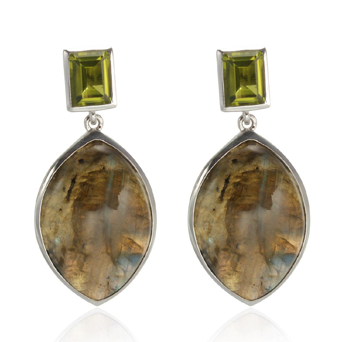 Sterling Silver Labradorite & Peridot Earrings: Crafted from sterling silver, these earrings feature sparkling step -cut Peridot with dangling marquise shaped Labradorite cabochons. These earrings will always look as good as you do! Frame your face