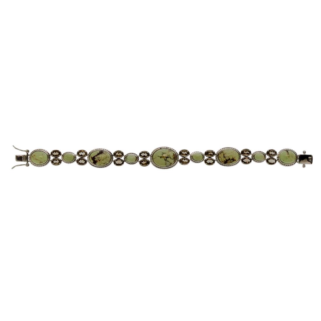 Smoky Quartz & Genuine Lemon Chrysophrase Bracelet: This lovely bracelet from the Pangea Mines Treasured Gems Collection is designed to drape gracefully from your wrist. Beautifully crafted in gleaming rhodium plate over sterling silver, this impressiv