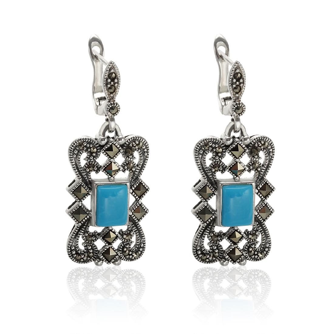 Sterling Silver Turquoise & Marcasite Earrings: • Genuine Sleeping Beauty Turquoise & Marcasite • Latch back for comfortable fit • Gleaming rhodium over fine sterling silver