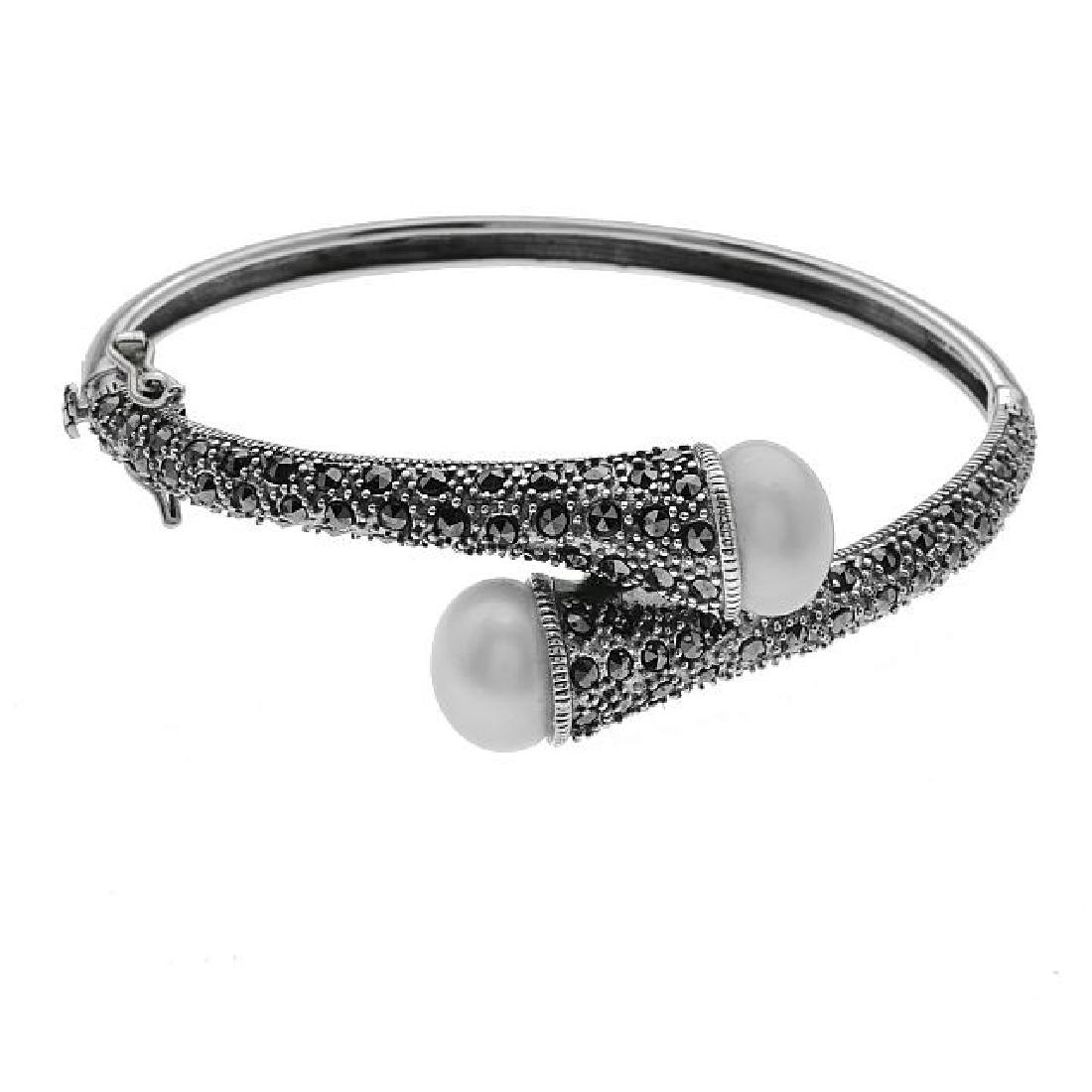 Silver FreshwaterPearl & Marcasite Bypass Bracelet: • Genuine Freshwater Pearls & Marcasite • Hinged & slide insert secured clasp • Gleaming rhodium over fine sterling silver