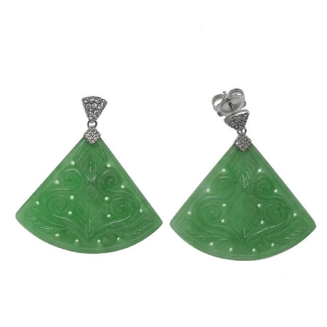Silver Carved Jade & Zircon Fan Drop Earrings: • Genuine Carved Red Jade & white Zircon •Carved jade with leaf and vine swirls •Secured butterfly clasp •Fine sterling silver