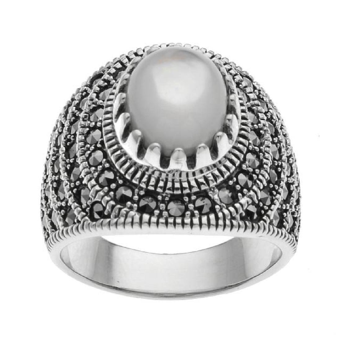 Sterling Silver MOP & Marcasite Ring-SZ 8: Addison Lane creates a beautiful statement ring from the Bora Bora Collection and adorns it with an impressive iridescent mother of pearl cabochon with genuine marcasite accents. Crafted in oxidized s
