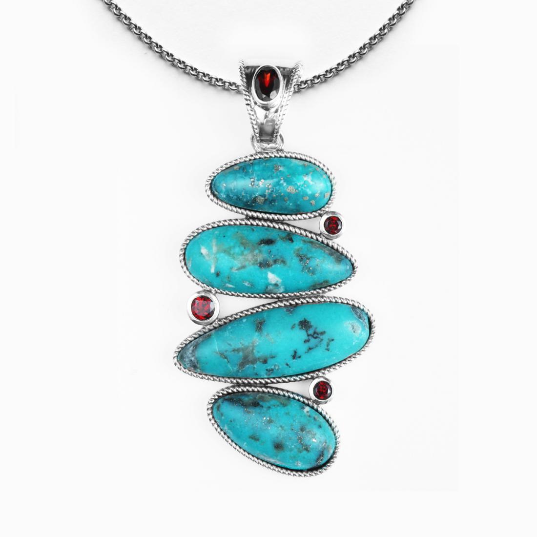 Silver Campo Frio Turquoise & Garnet Pendant: Heavenly turquoise and fiery Mozambique garnet combine in this striking pendant necklace from the Pangea Mines Native Soul Collection. Beautifully crafted in rhodium over sterling silver and embellish