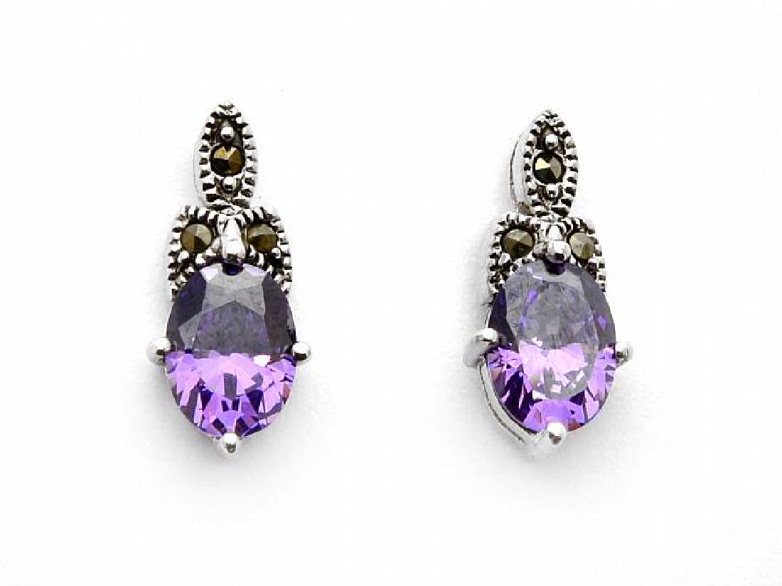 Sterling Silver Oval Amethyst & Marcasite Earrings: â€¢ Genuine marcasite â€¢Amethyst cubic zirconia â€¢ Butterfly backings for comfortable fit â€¢ Fine Sterling Silver