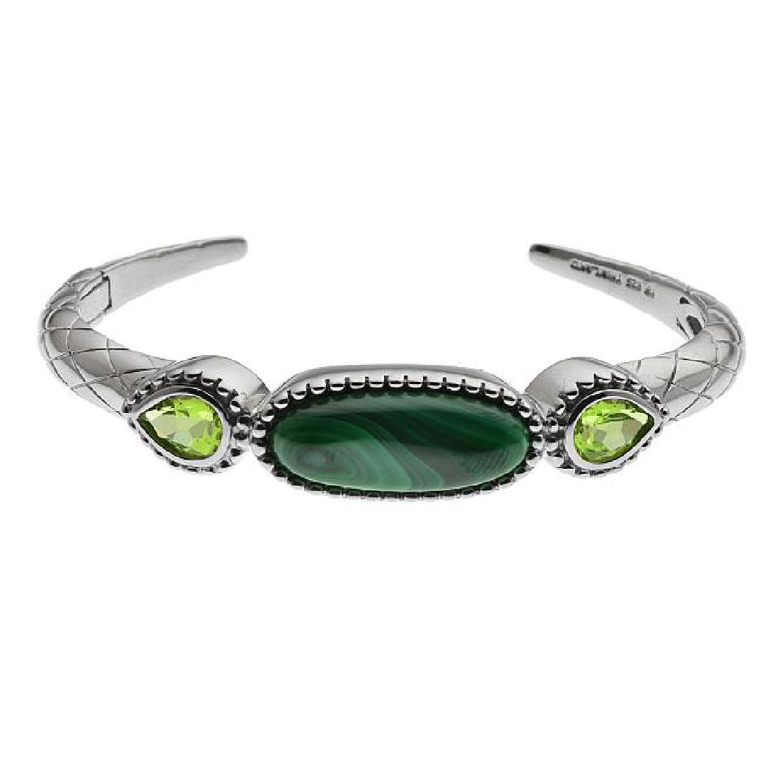 Silver 2.08cwt Peridot & Malachite Textured Cuff: â€¢ Genuine peridot & malachite â€¢ 2.08cwt peridot â€¢ Hinged cuff â€¢ 6.75 inch wearable length â€¢ Crafted in polished rhodium over Fine sterling silver