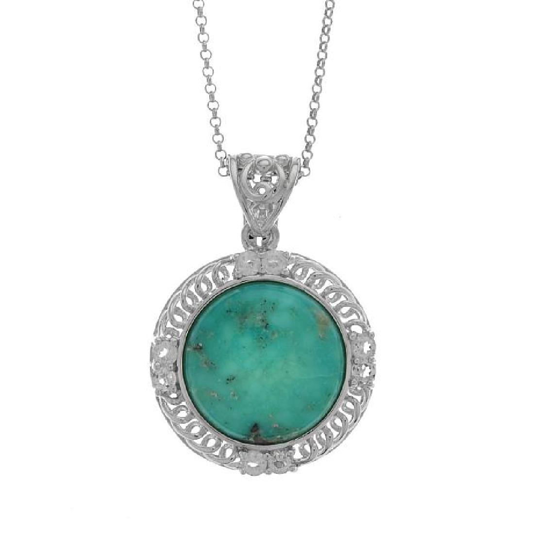 Sterling Silver Campo Frio & Topaz Pendant: Genuine Turquoise is surrounded by a border of sparkling white topaz on a beautifully crafted rhodium, over sterling silver setting to create an eye-catching design. A complementary 18â€ rolo chain