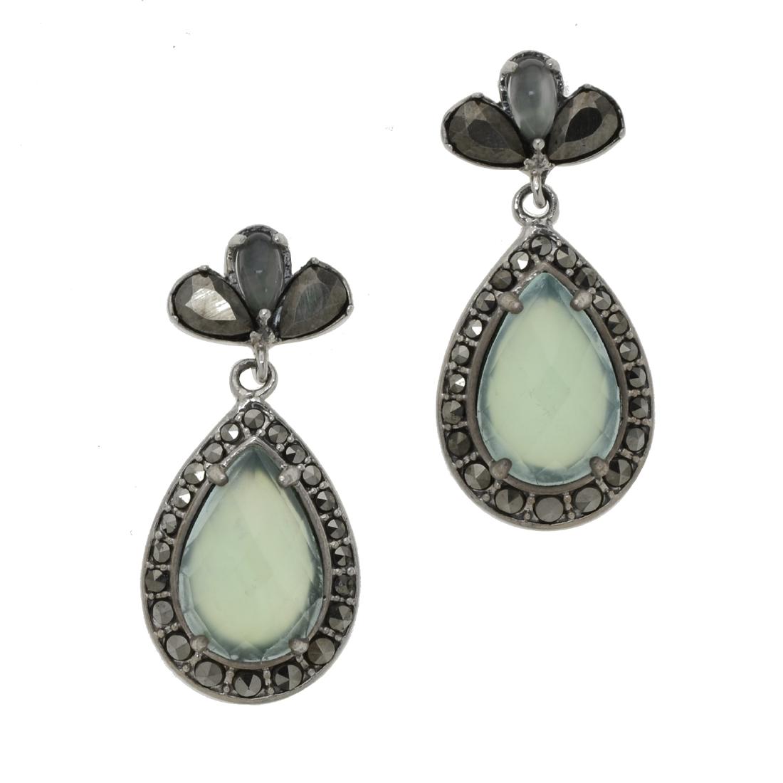 Silver Chalcedony & Marcasite Drop Earrings: • Genuine green chalcedony & marcasite • Pear shaped drop • Secured butterfly back • Gleaming rhodium over fine sterling silver