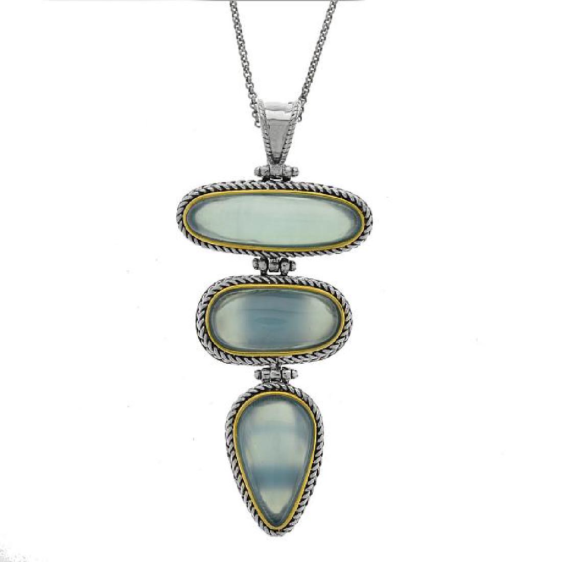 Silver Blue Chalcedony 3-Stone Drop Pendant: • Genuine blue chalcedony • Uniquely stacked bold piece • 18” silver chain • Gleaming rhodium over fine sterling silver