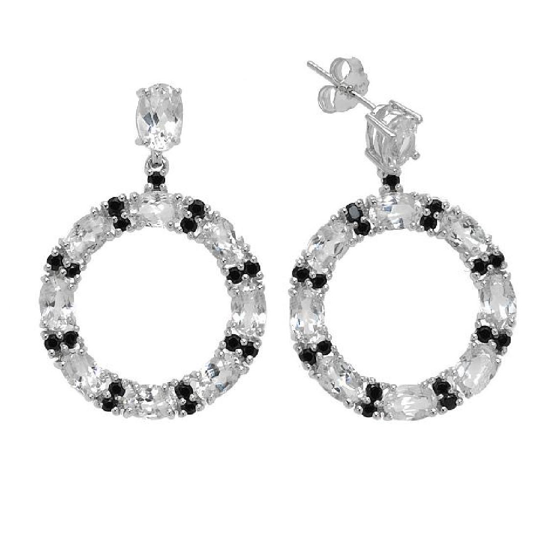 Silver White Topaz & Black Spinel Hoop Earrings: You’ll love the smart contemporary lines of these lovely circular drop earrings from the Pangea Mines Treasured Gems Collection. Genuine white topaz and black spinel beautifully crafted sterling